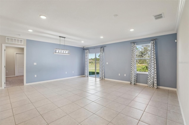 tiled empty room with crown molding and plenty of natural light