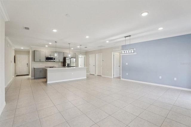 unfurnished living room featuring light tile patterned floors and ornamental molding