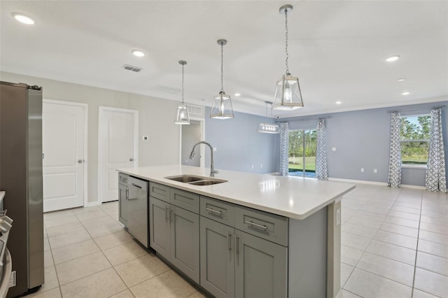 kitchen with gray cabinetry, sink, hanging light fixtures, a center island with sink, and appliances with stainless steel finishes