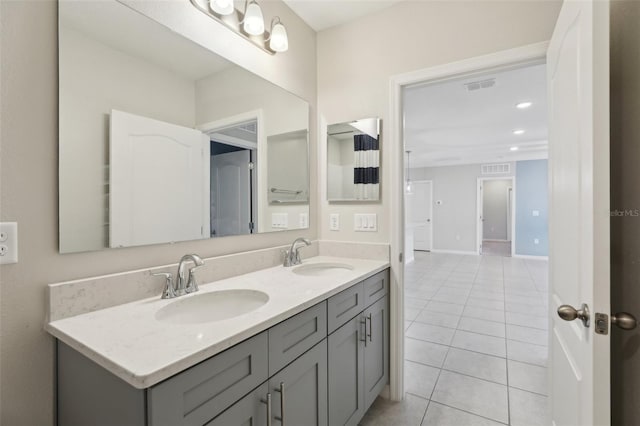 bathroom with tile patterned flooring and vanity