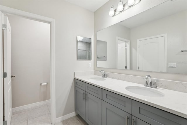 bathroom with tile patterned floors and vanity