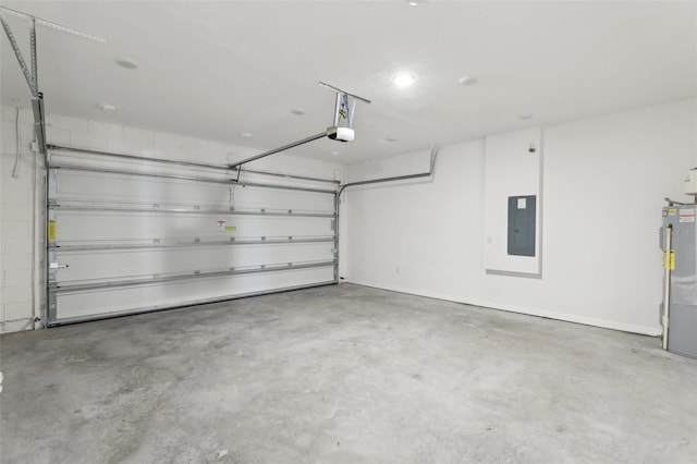 garage featuring a garage door opener, electric panel, and water heater