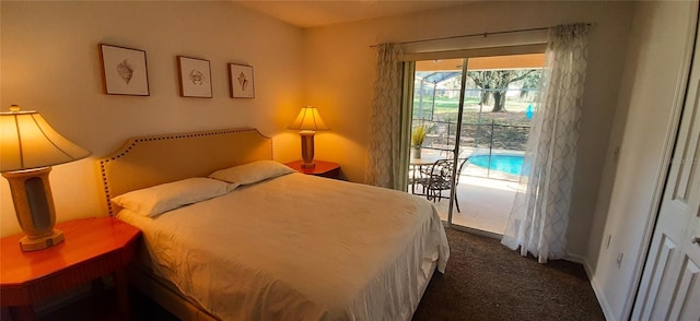 bedroom with dark colored carpet and access to outside