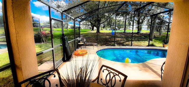 view of swimming pool featuring glass enclosure and a patio area