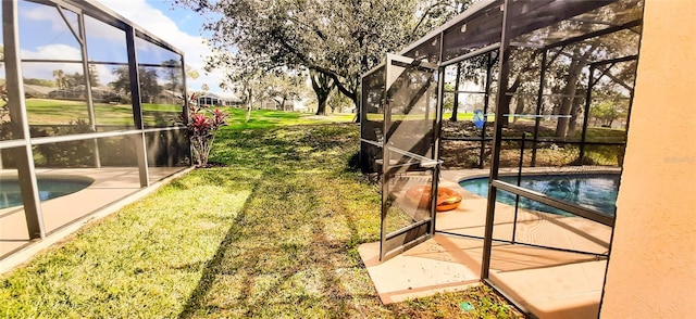 view of pool featuring a lawn and a patio