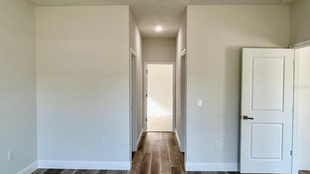 hall with dark hardwood / wood-style floors