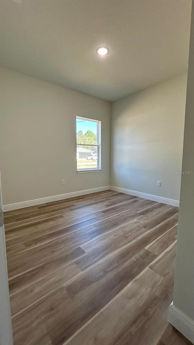 empty room featuring hardwood / wood-style flooring