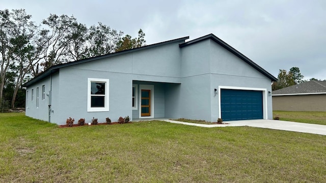 view of front of property featuring a front yard, an attached garage, and stucco siding