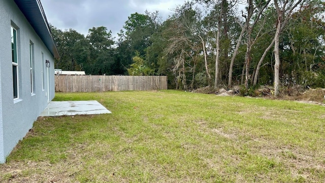 view of yard with a patio area and fence