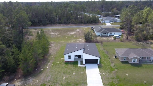 559 Marion Oaks Blvd, Ocala, FL 34473 - drone / aerial view with a wooded view
