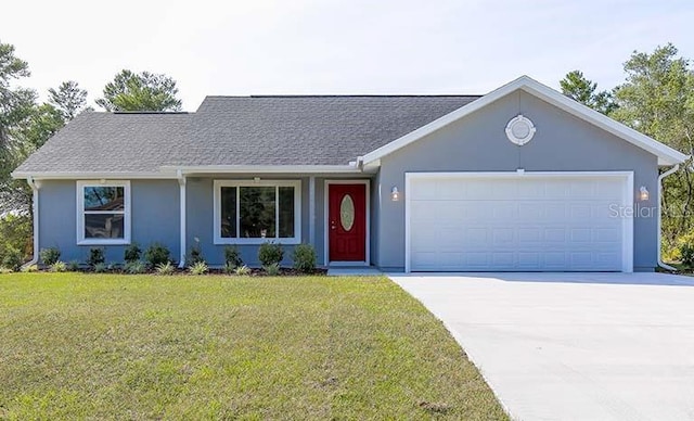 single story home with a front yard and a garage