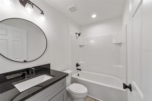 full bathroom featuring bathtub / shower combination, vanity, and toilet