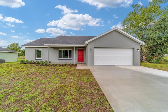 ranch-style house featuring central AC, a front lawn, and a garage