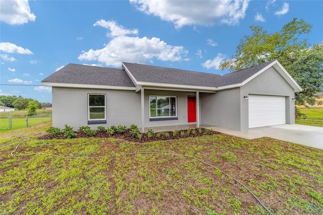 single story home featuring a garage