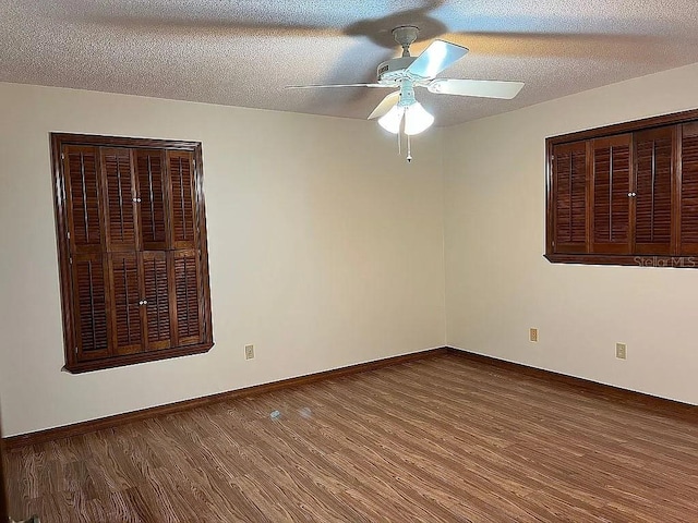 unfurnished room featuring hardwood / wood-style floors, a textured ceiling, and ceiling fan