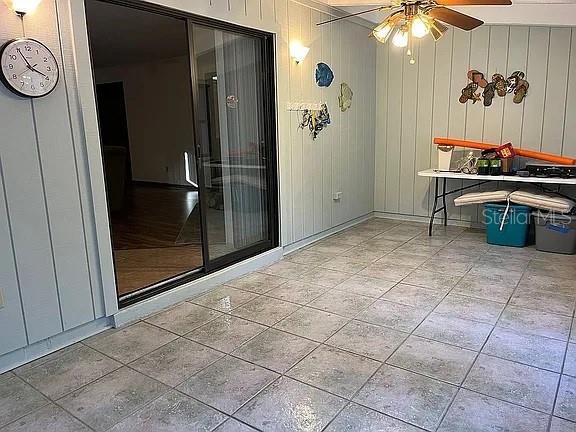 view of patio featuring ceiling fan