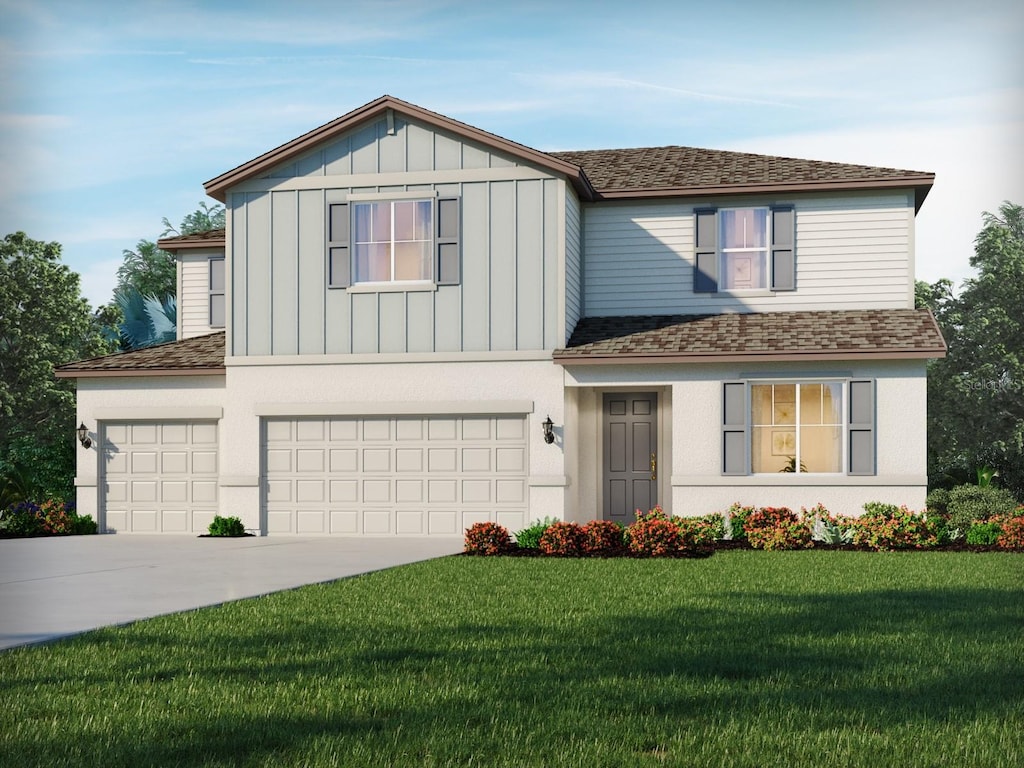 view of front of property with a garage and a front yard