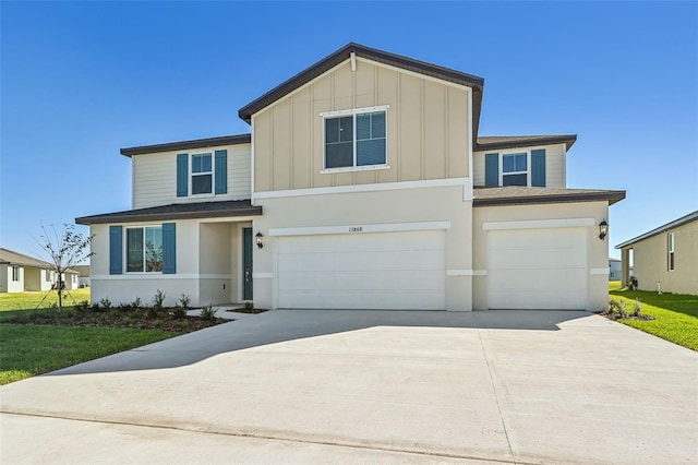 view of front of house featuring a front yard and a garage