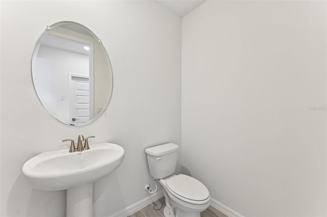 bathroom with toilet and sink