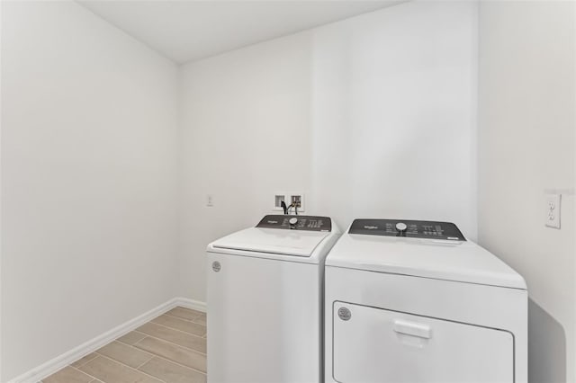 washroom featuring washer and clothes dryer