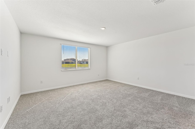 spare room featuring carpet flooring