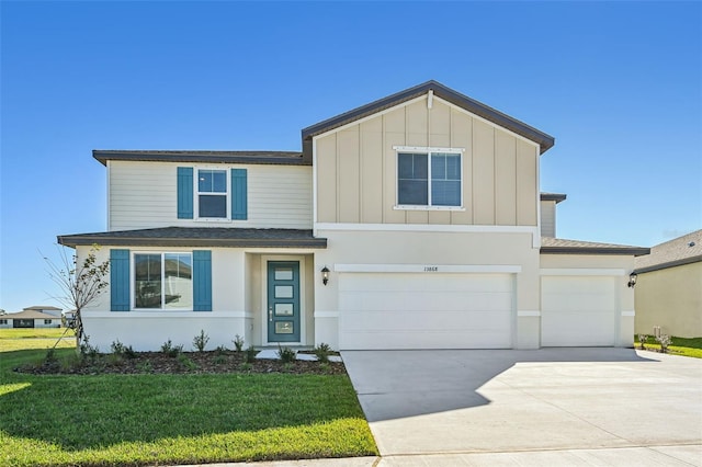 view of front facade with a front yard and a garage