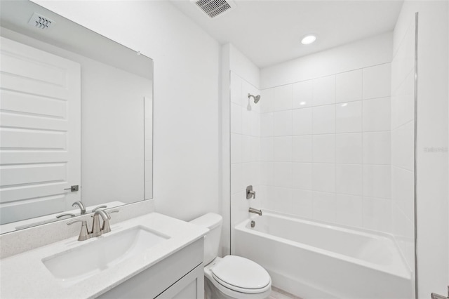 bathroom featuring visible vents, toilet,  shower combination, and vanity