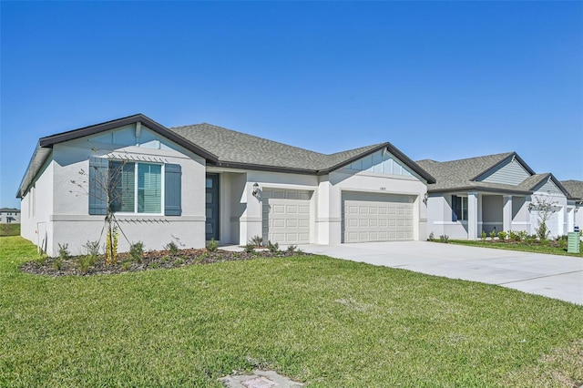 view of front of home with a garage and a front lawn