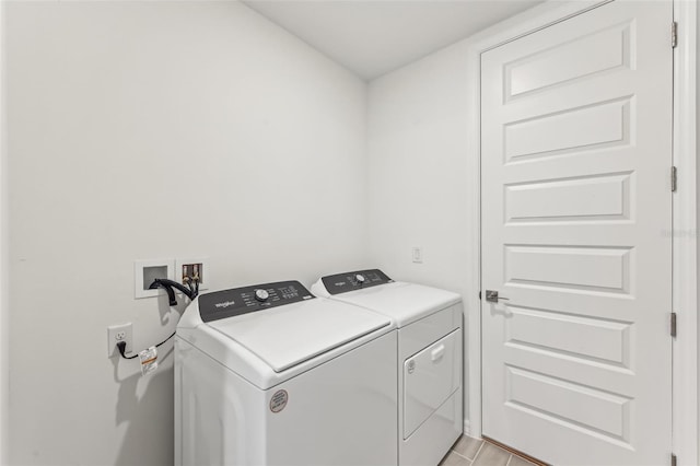 washroom featuring independent washer and dryer