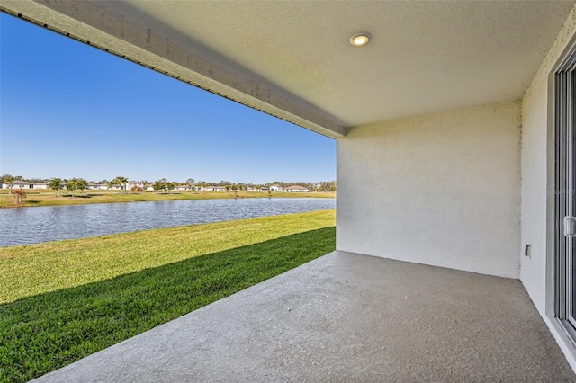 view of patio featuring a water view