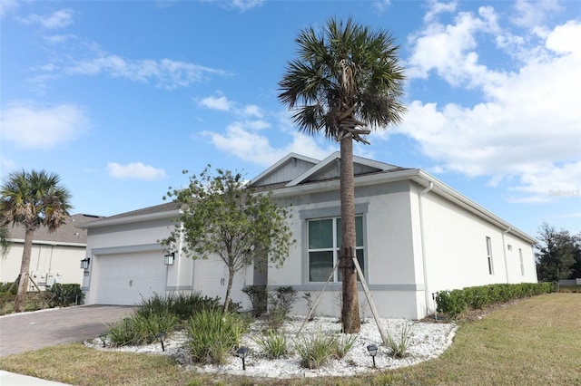 view of front of property with a garage and a front yard