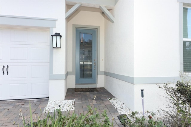 entrance to property featuring a garage