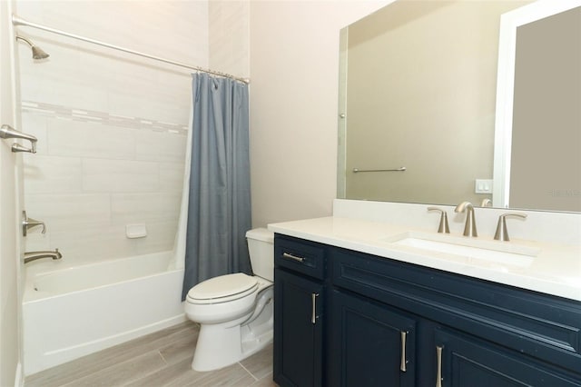 full bathroom featuring shower / bath combo, toilet, and vanity