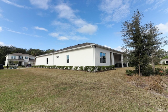 view of home's exterior featuring a yard