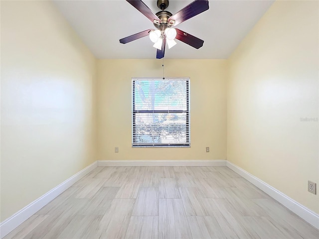 spare room featuring ceiling fan and light wood-type flooring