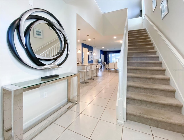 stairs featuring tile patterned floors