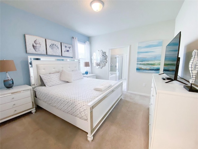 carpeted bedroom featuring connected bathroom