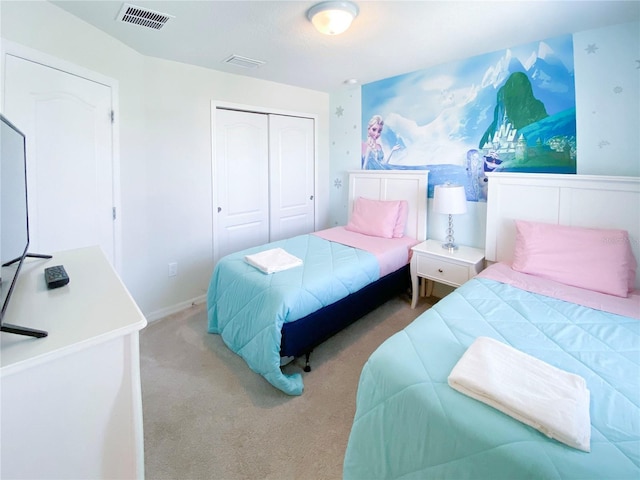 carpeted bedroom featuring a closet