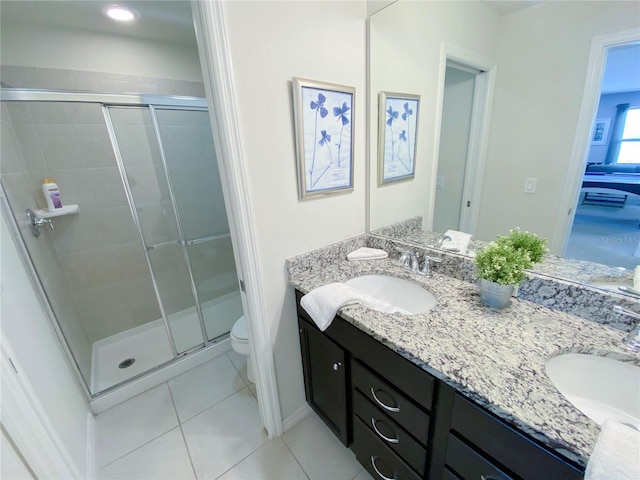 8956 Zurich Ln, Kissimmee, FL 34747 - bathroom with double vanity, a shower stall, and tile patterned floors