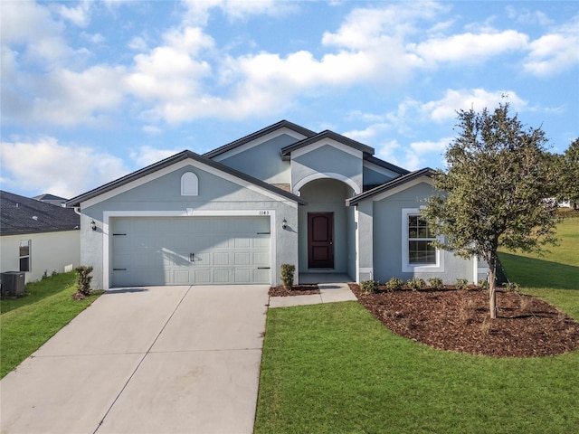 ranch-style home featuring a front lawn, central AC, and a garage