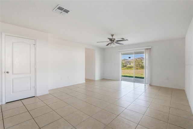 unfurnished room featuring ceiling fan and light tile patterned floors