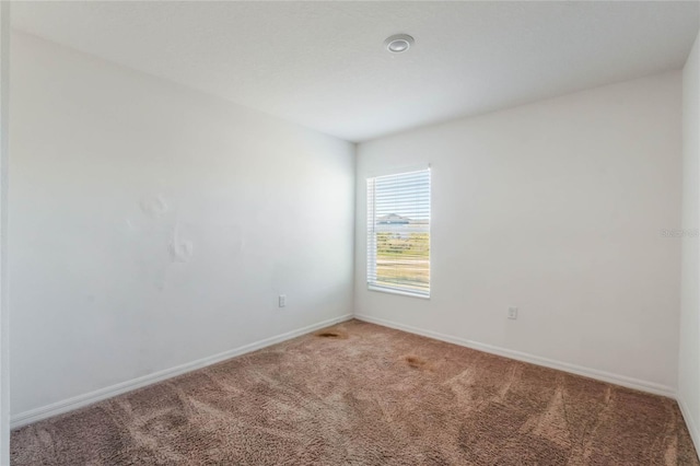 empty room featuring carpet flooring