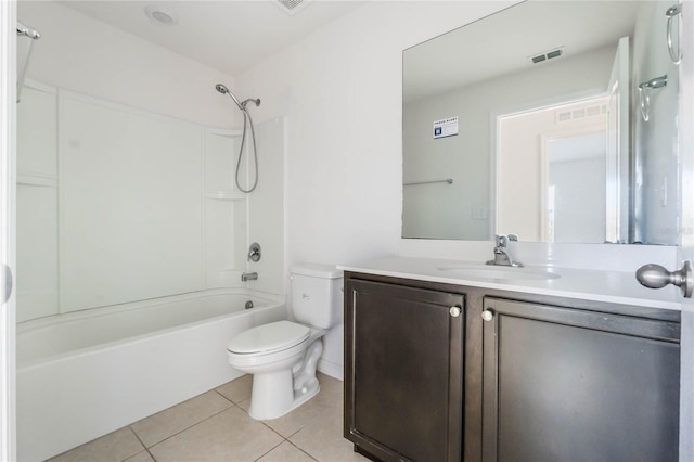 full bathroom featuring toilet, vanity, tile patterned flooring, and shower / bath combination