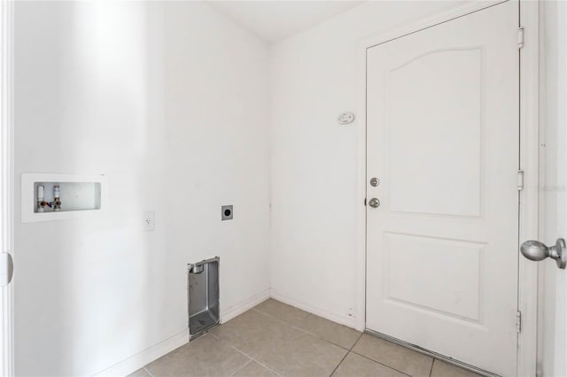 washroom with washer hookup, light tile patterned floors, and hookup for an electric dryer