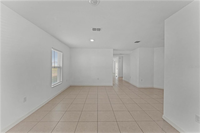 empty room with light tile patterned floors