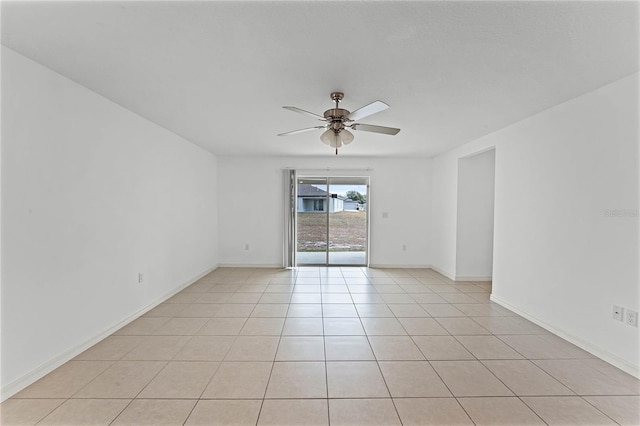 tiled empty room with ceiling fan