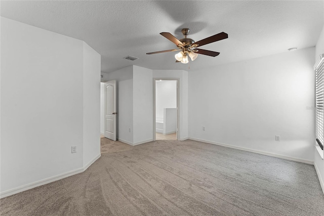 interior space featuring ceiling fan and a textured ceiling