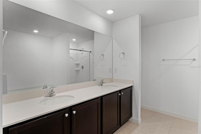 bathroom with vanity and tile patterned flooring