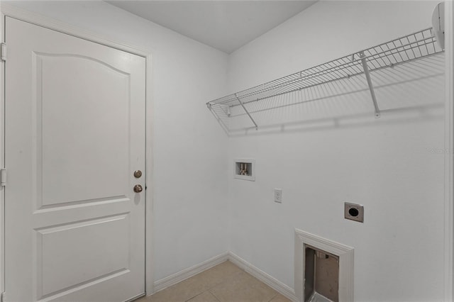 laundry room featuring light tile patterned floors, hookup for a washing machine, and electric dryer hookup