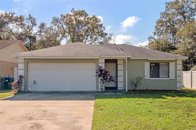 single story home with a front yard and a garage